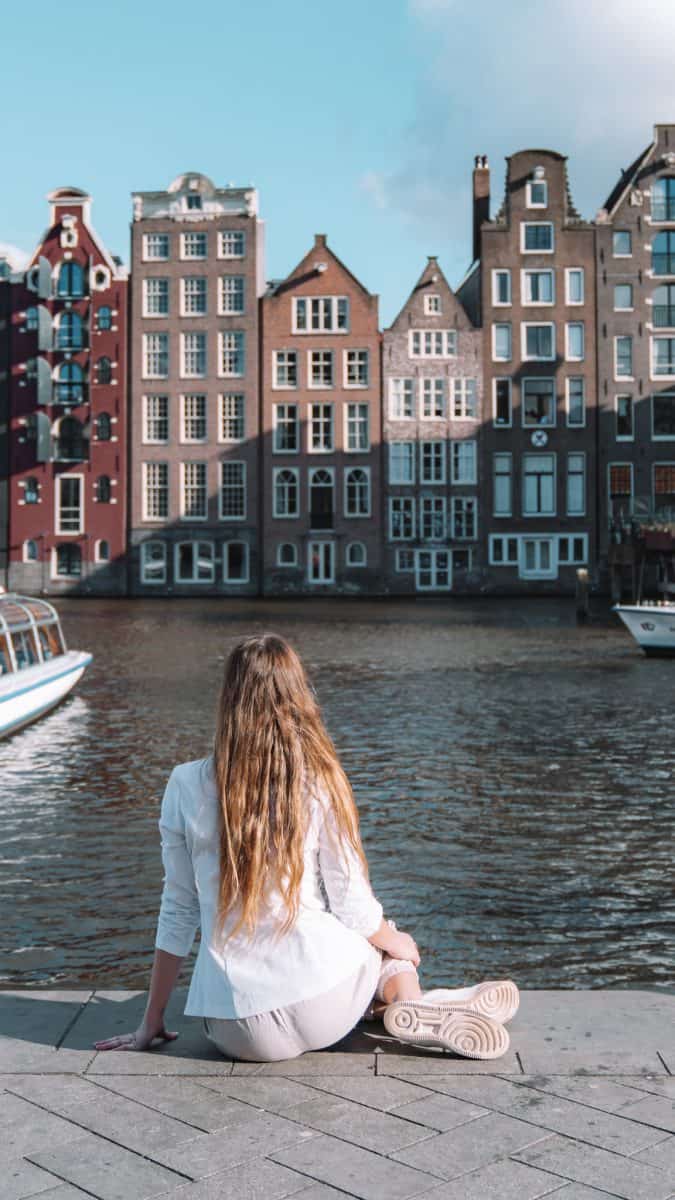 solo travel to amsterdam damrak the fearless wanderess